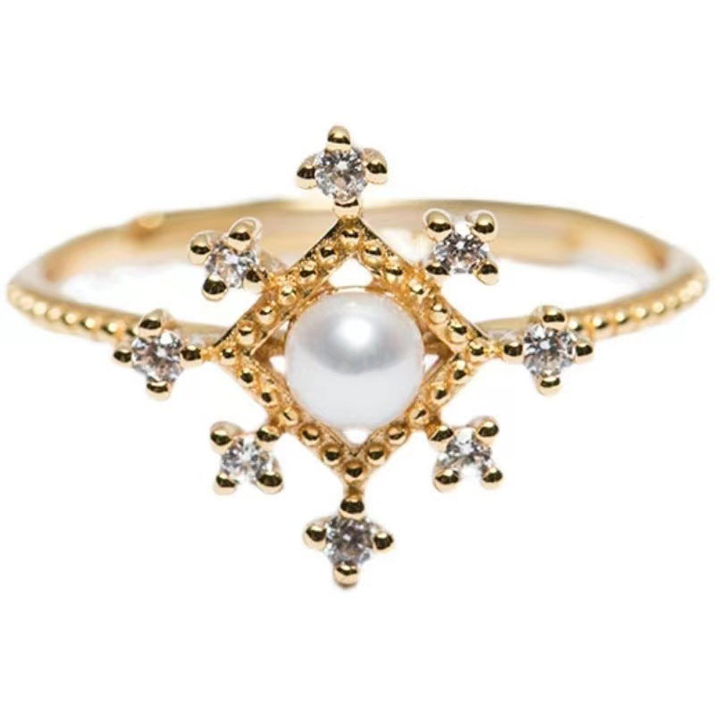 Bague en perles naturelles avec détails en or