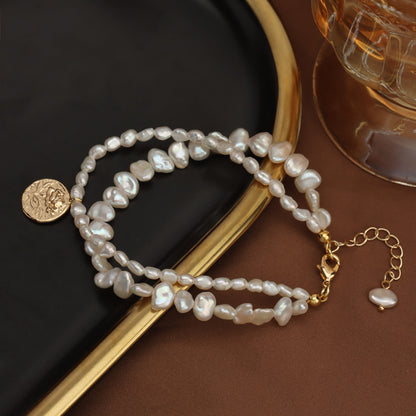 Bracelet en perles naturelles d'eau douce avec motif gravé - Un bijou exquis pour sublimer votre style ✨