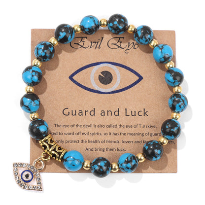 Bracelet perles turquoise et noires, œil protecteur